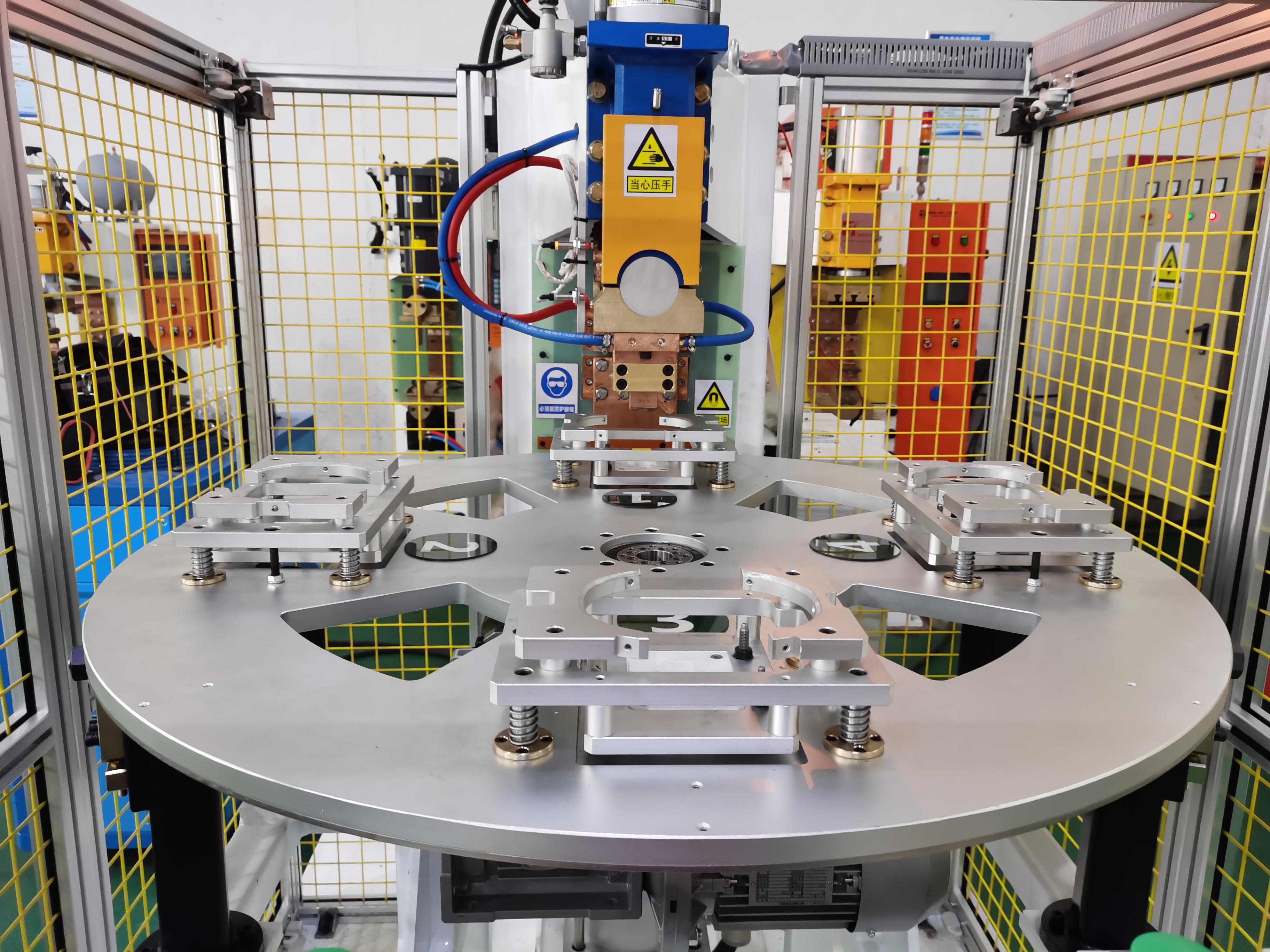 压缩机壳体支架四工位凸焊机项目介绍 压缩机壳体支架四工位凸焊机项目介绍